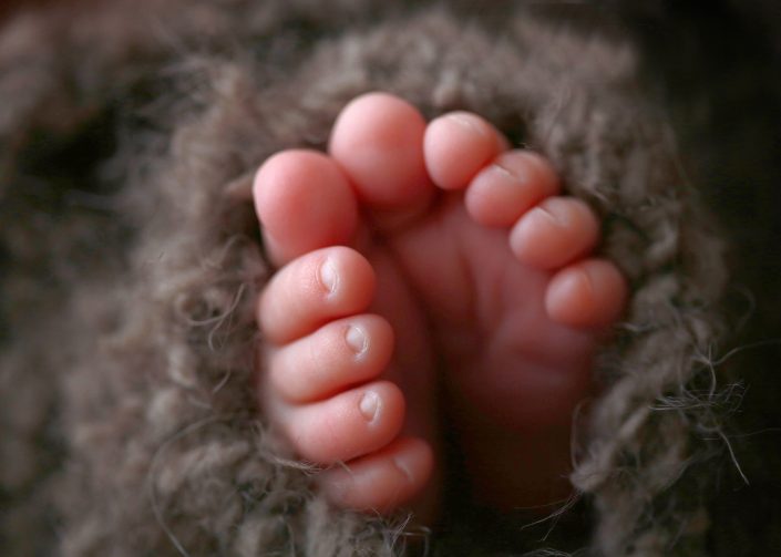 Newborn baby feet wrapped in woollen blanket - Shannon Elise Photography