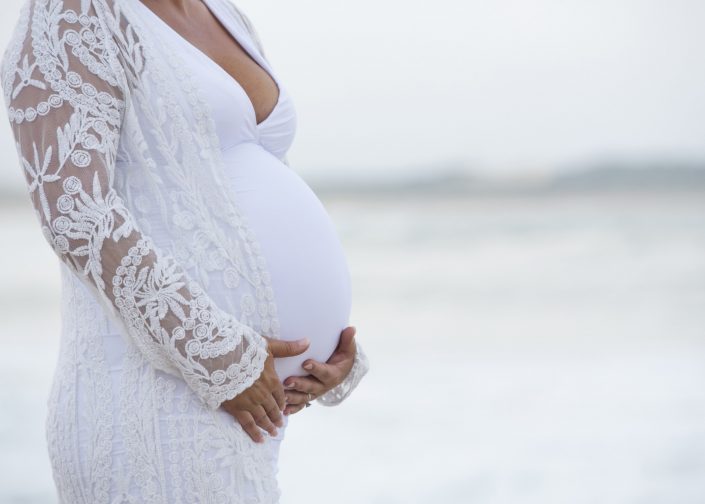 Pregnant Woman in White