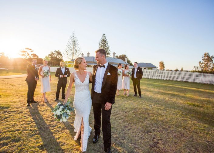 husband and wife with bridal party